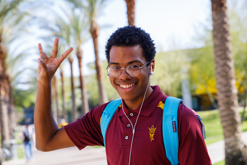 ASU student doing the pitchfork sign