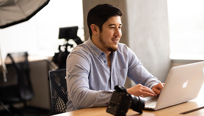 Student at his laptop focusing on his future career
