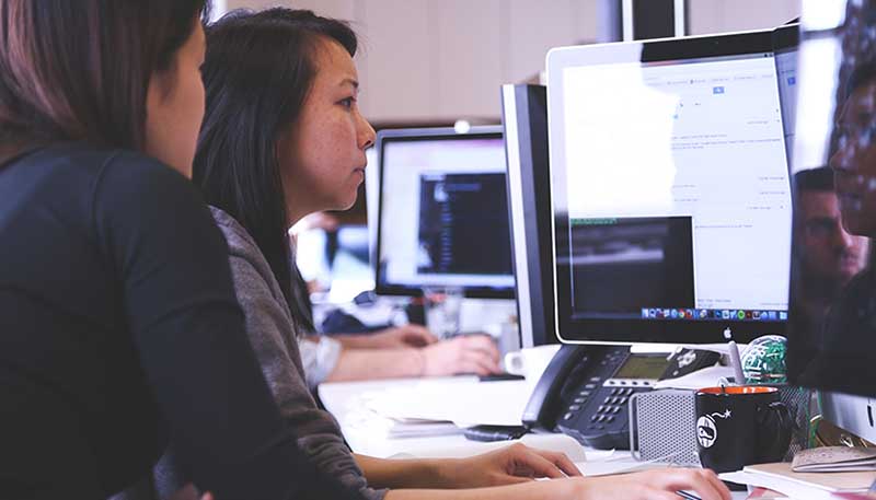 Two students using computer