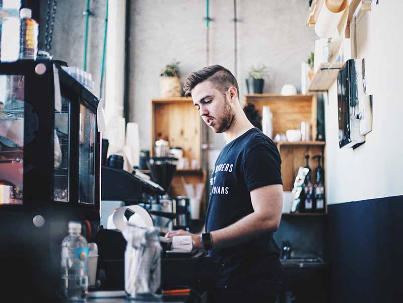 student working at his part-time job